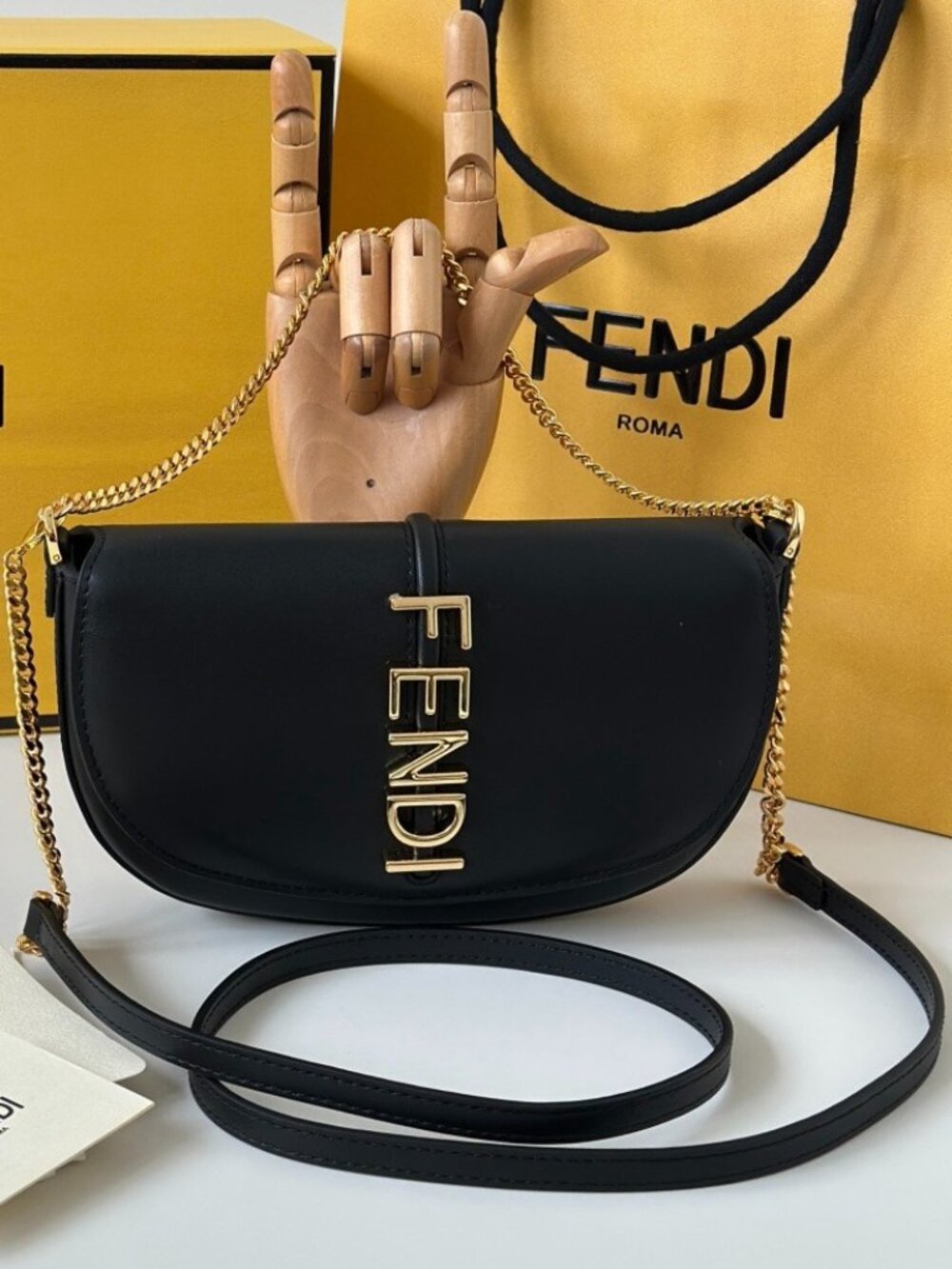 Fendi Fendigraphy series chain clutch bag.